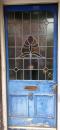 An old door with broken window