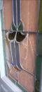A broken front door window 